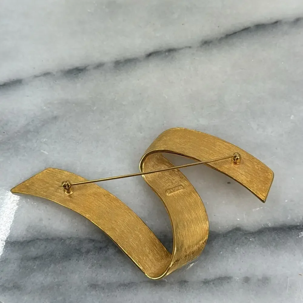 Vintage monet gold ribbon swoosh brooch